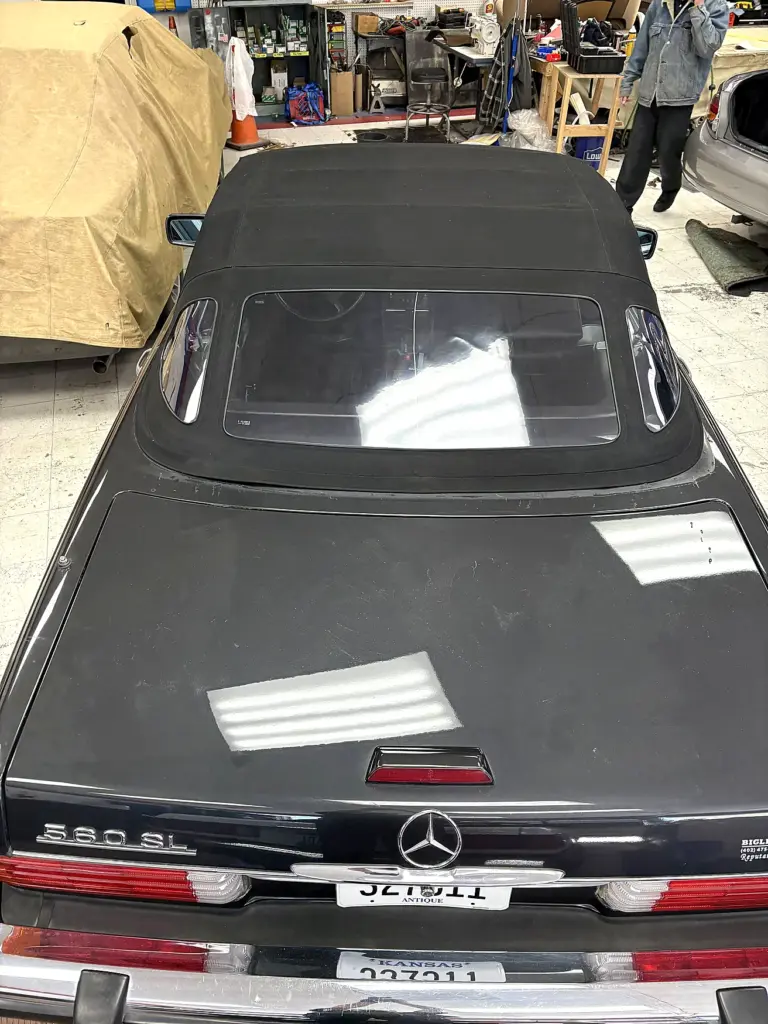 Rear view of Mercedes-Benz SL with black convertible roof