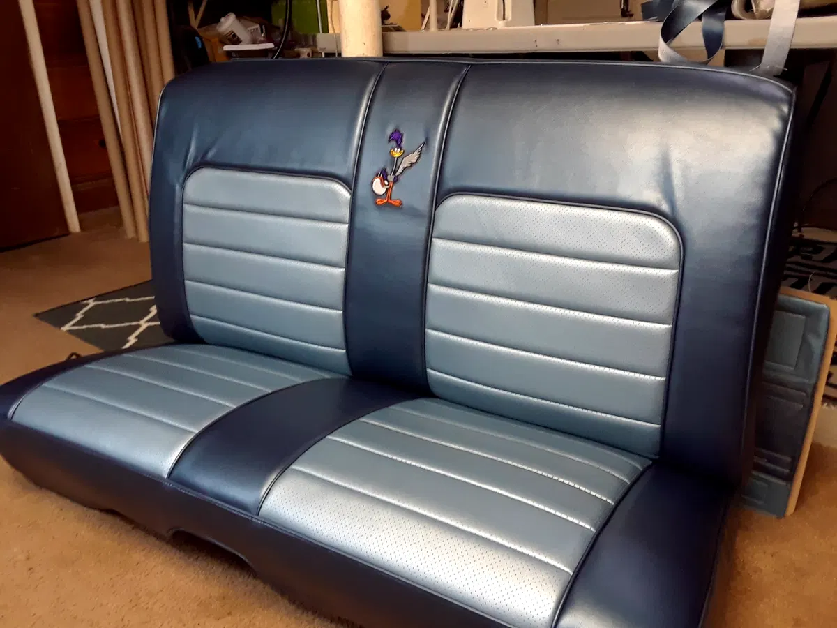 Another finished vintage bench seat with contrasting navy and silver upholstered panels