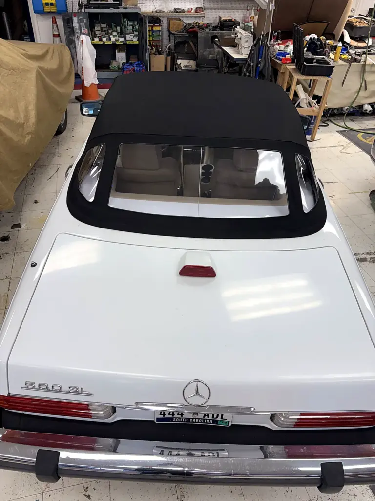 Rear view of Mercedes-Benz SL convertible with white fabric roof