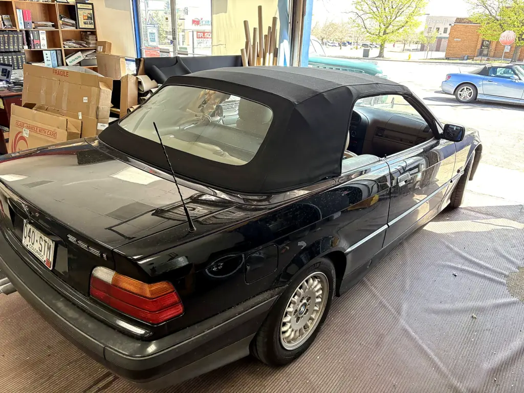 Classic BMW convertible with black soft top